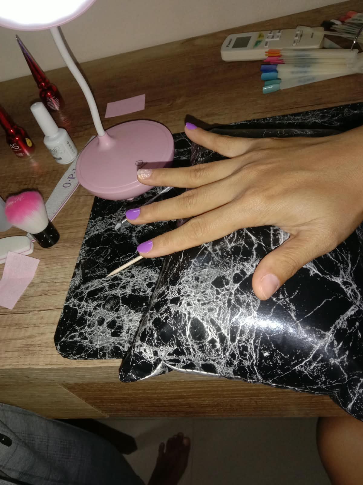 Manicure tools and freshly painted nails