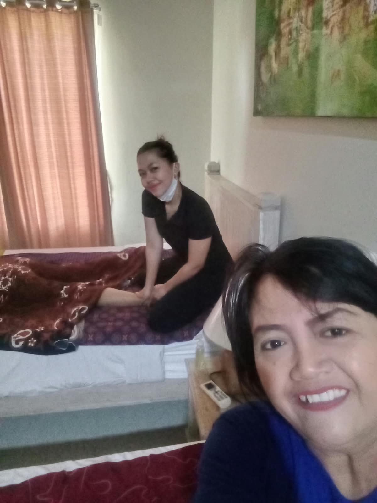 Therapists during an in-room massage visit
